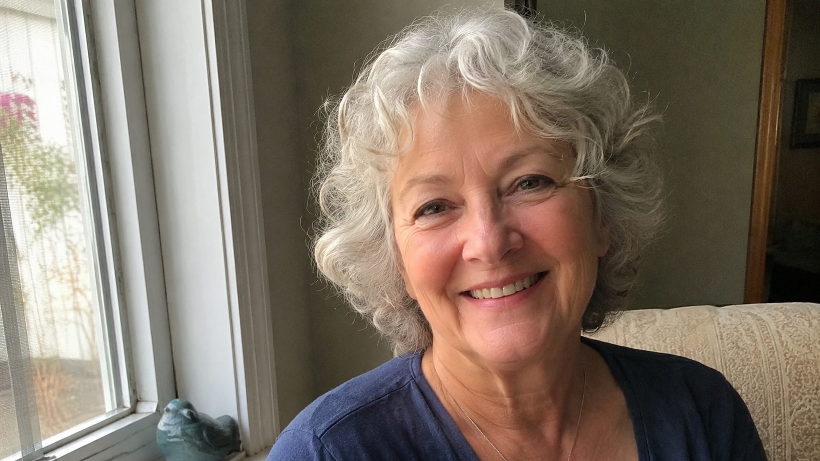An older woman with soft, flattering silver hair