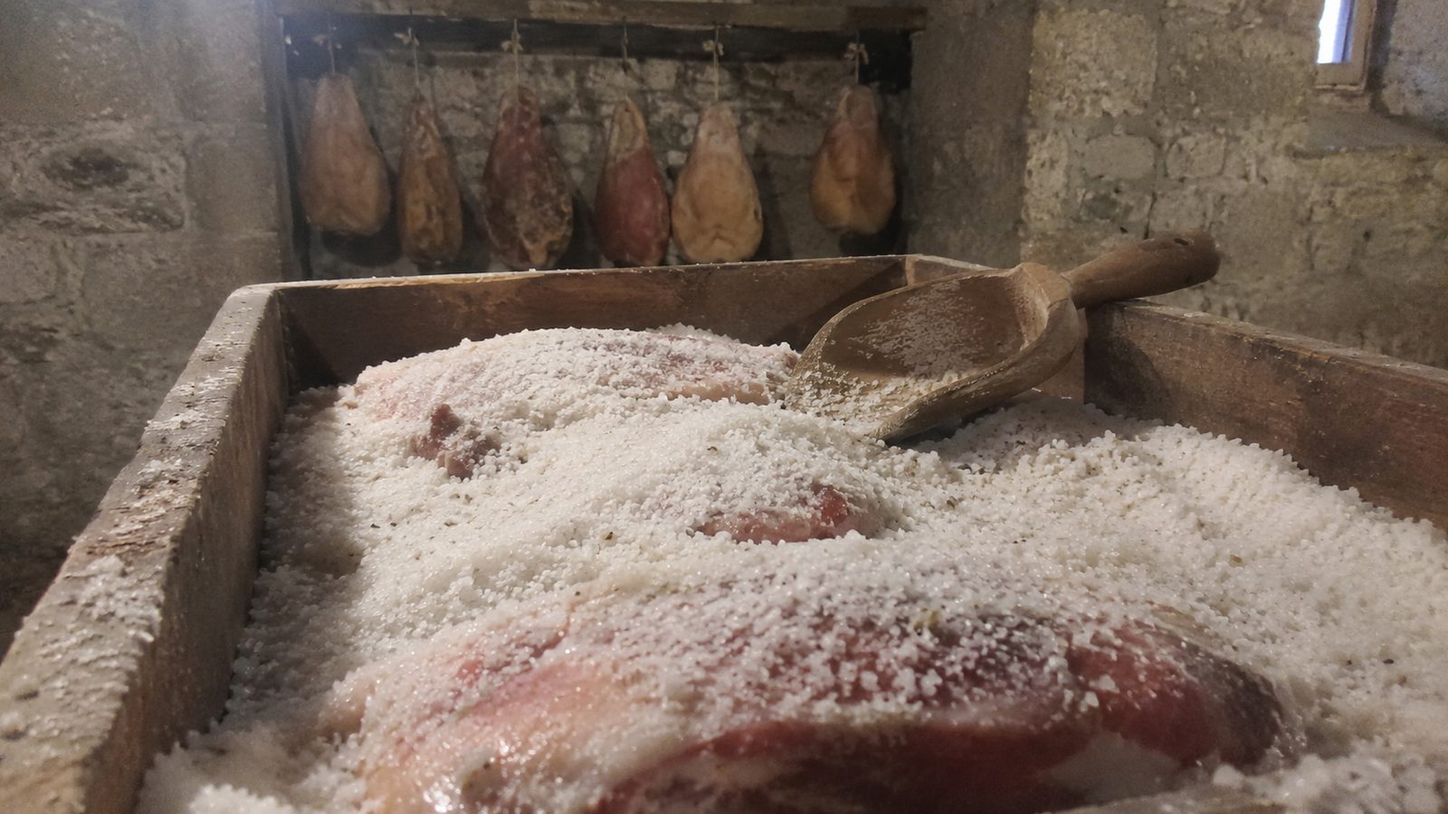 Pork packed in salt in a wooden curing box