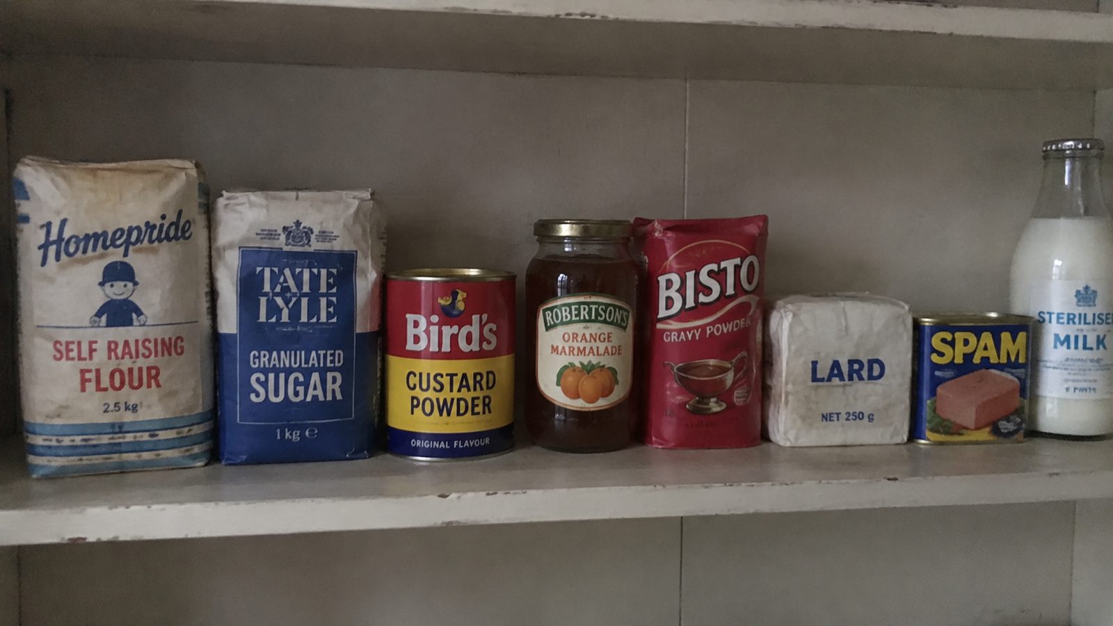 A page from the book showing a 1970s larder, shelf by shelf