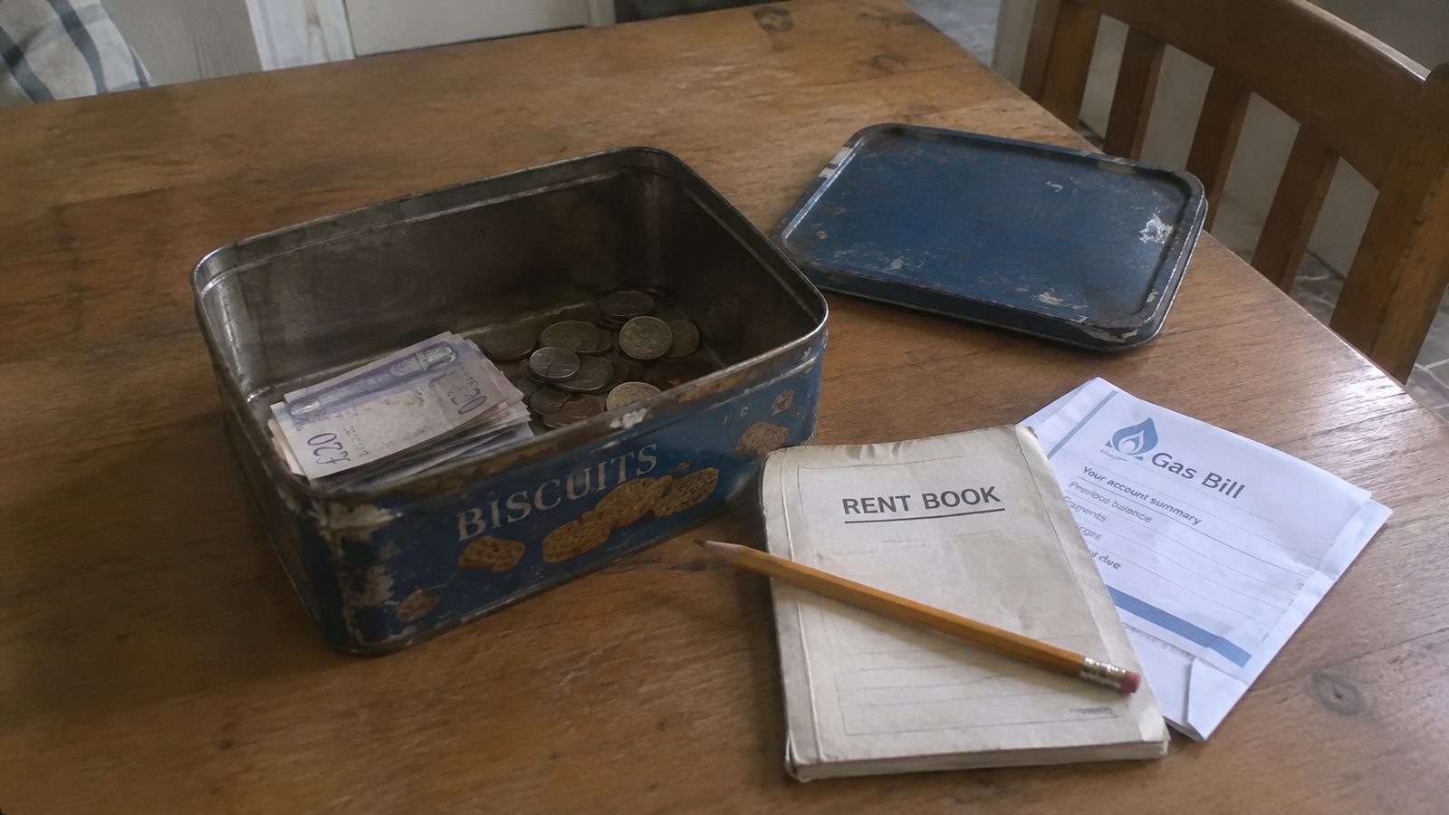 A page from the book showing the housekeeping tin and its labelled envelopes