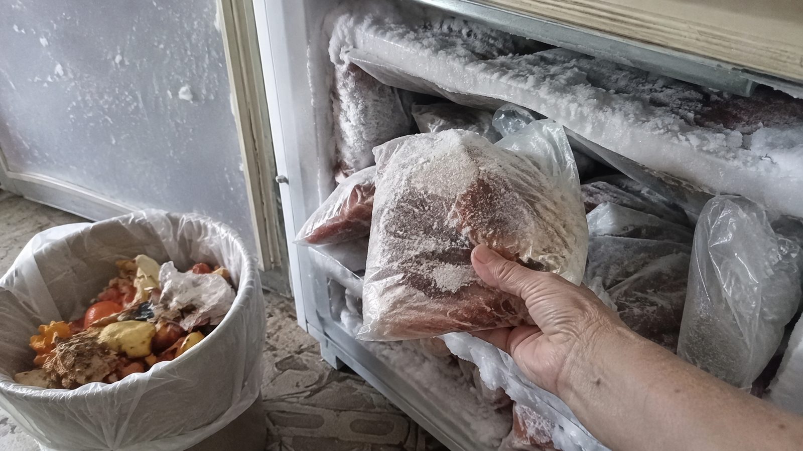 Spoiled food being thrown from the fridge into the trash